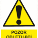 Výstražná bezpečnostní tabulka symbol s textem: "Pozor odletující částice"